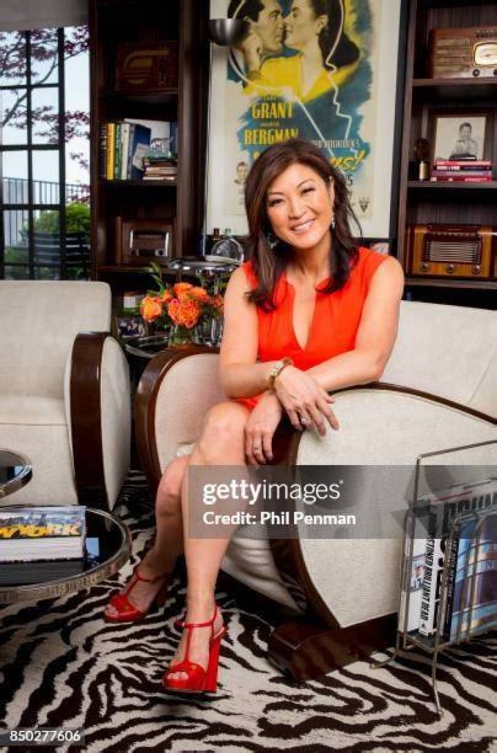 Journalist Juju Chang is photographed with husband Neal Shapiro, sons